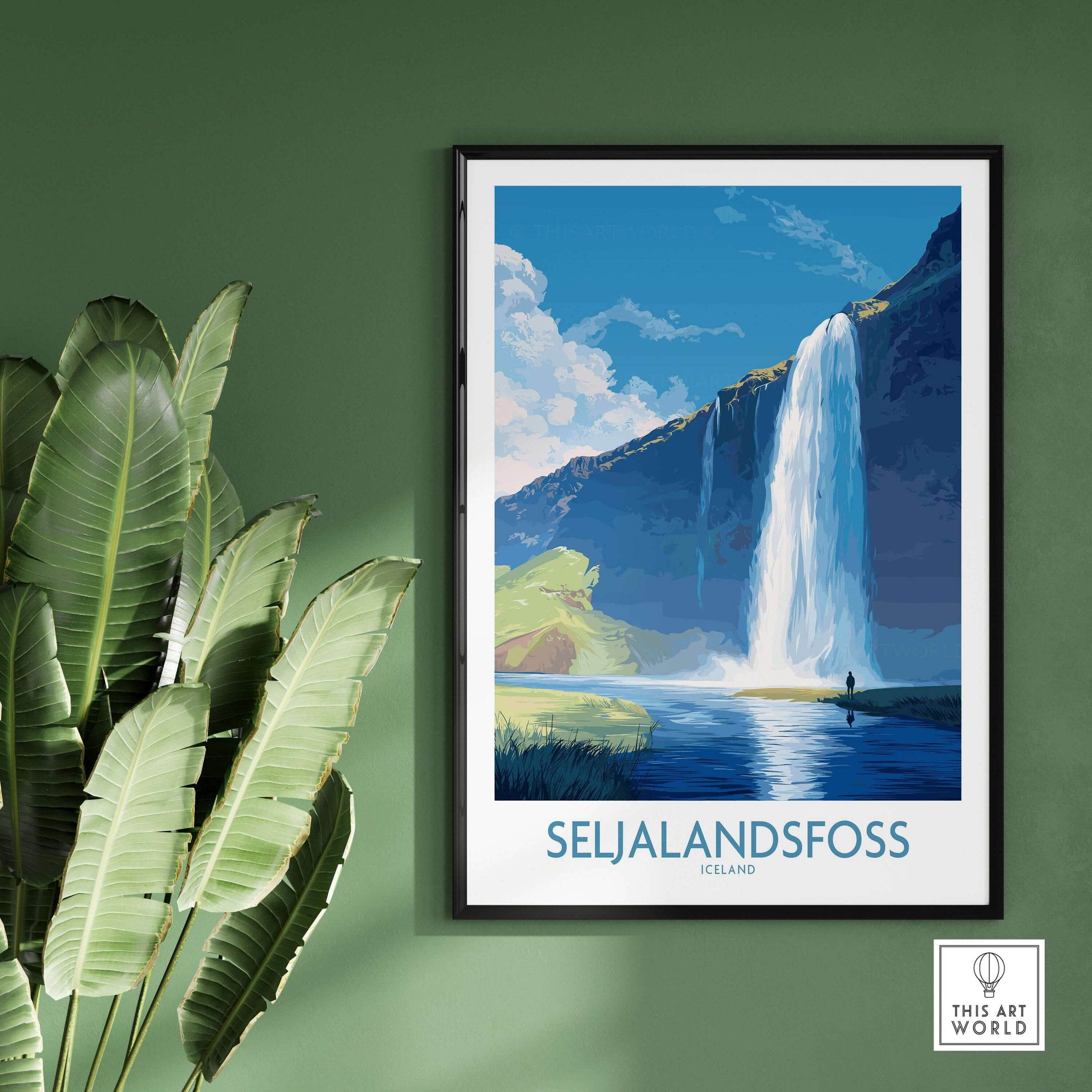 Seljalandsfoss Iceland Art Print featuring a stunning waterfall design in a modern frame against a green wall.