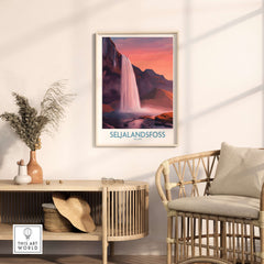 Seljalandsfoss Iceland Sunset Waterfall Art Print | Pink Sky Travel Poster displayed in a modern home interior.