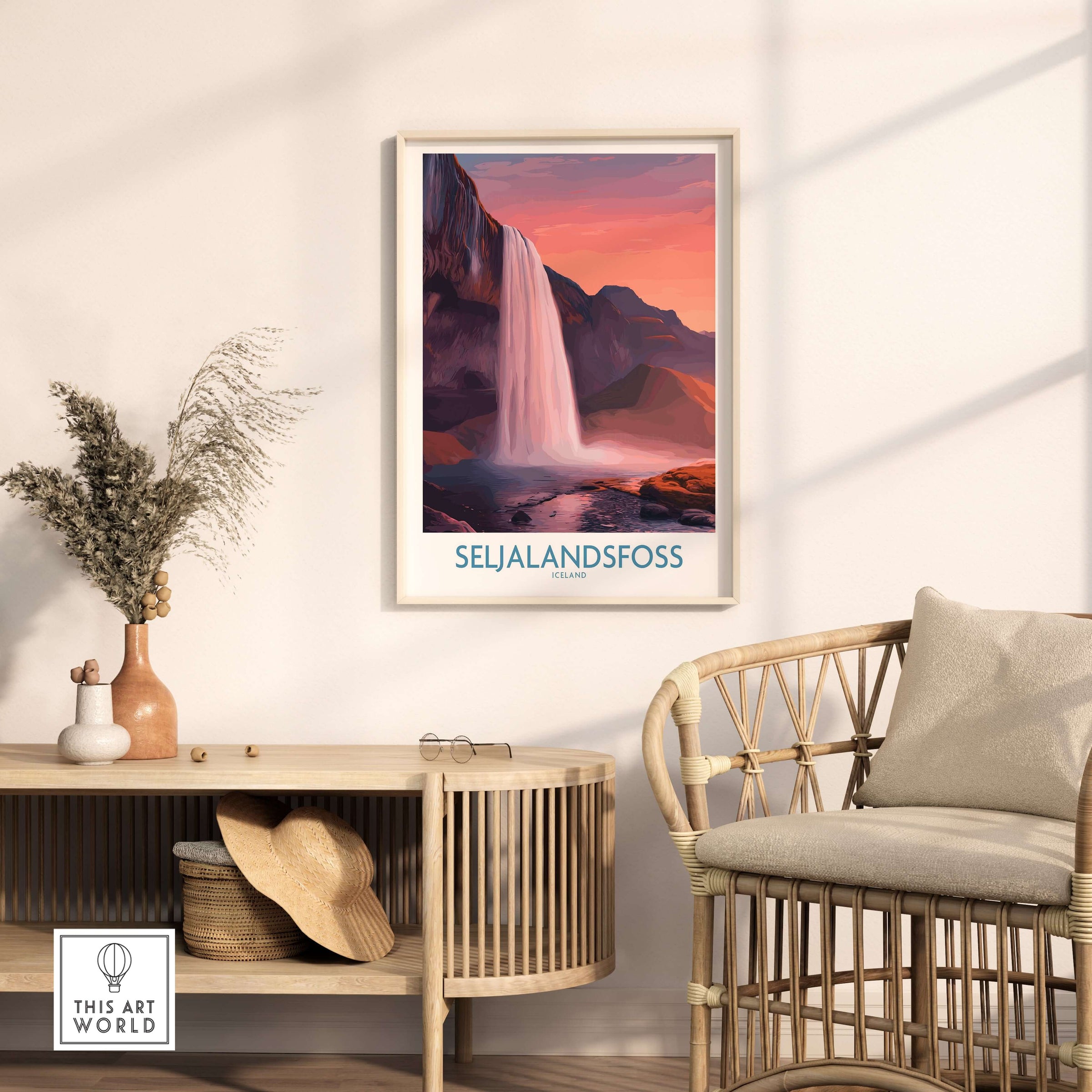 Seljalandsfoss Iceland Sunset Waterfall Art Print | Pink Sky Travel Poster displayed in a modern home interior.