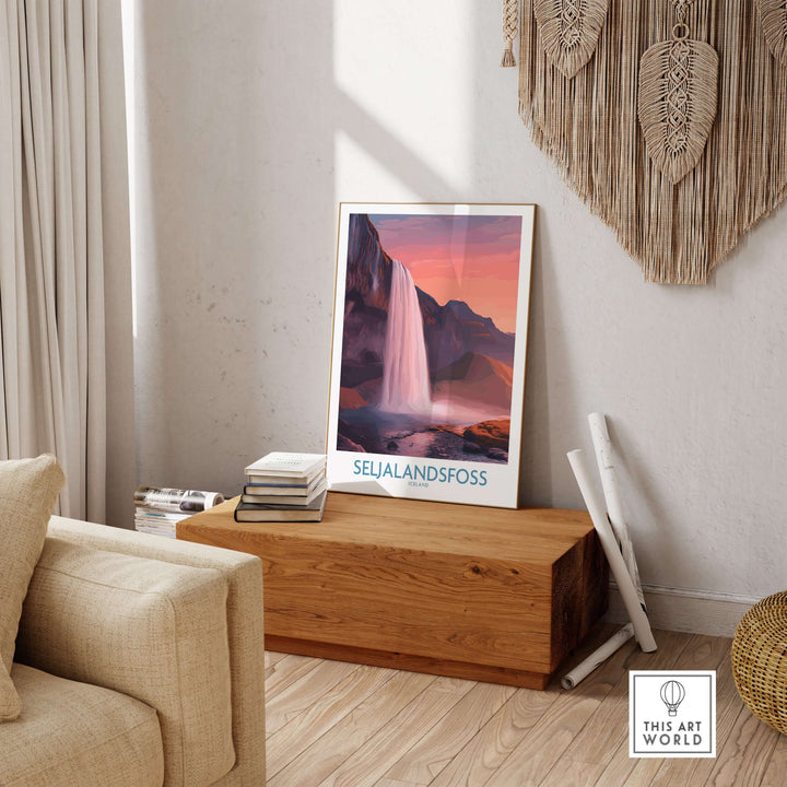 Seljalandsfoss Iceland Sunset Waterfall Art Print | Pink Sky Travel Poster displayed in a cozy living room setting.