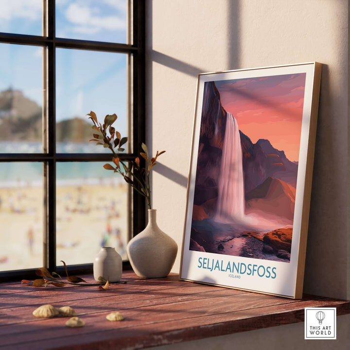 Seljalandsfoss Iceland Sunset Waterfall Art Print | Pink Sky Travel Poster displayed in a cozy interior setting.