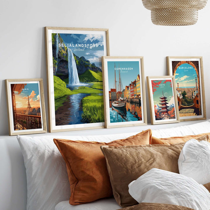 Seljalandsfoss Poster Iceland Print displayed with other travel posters in a stylish living room setting.