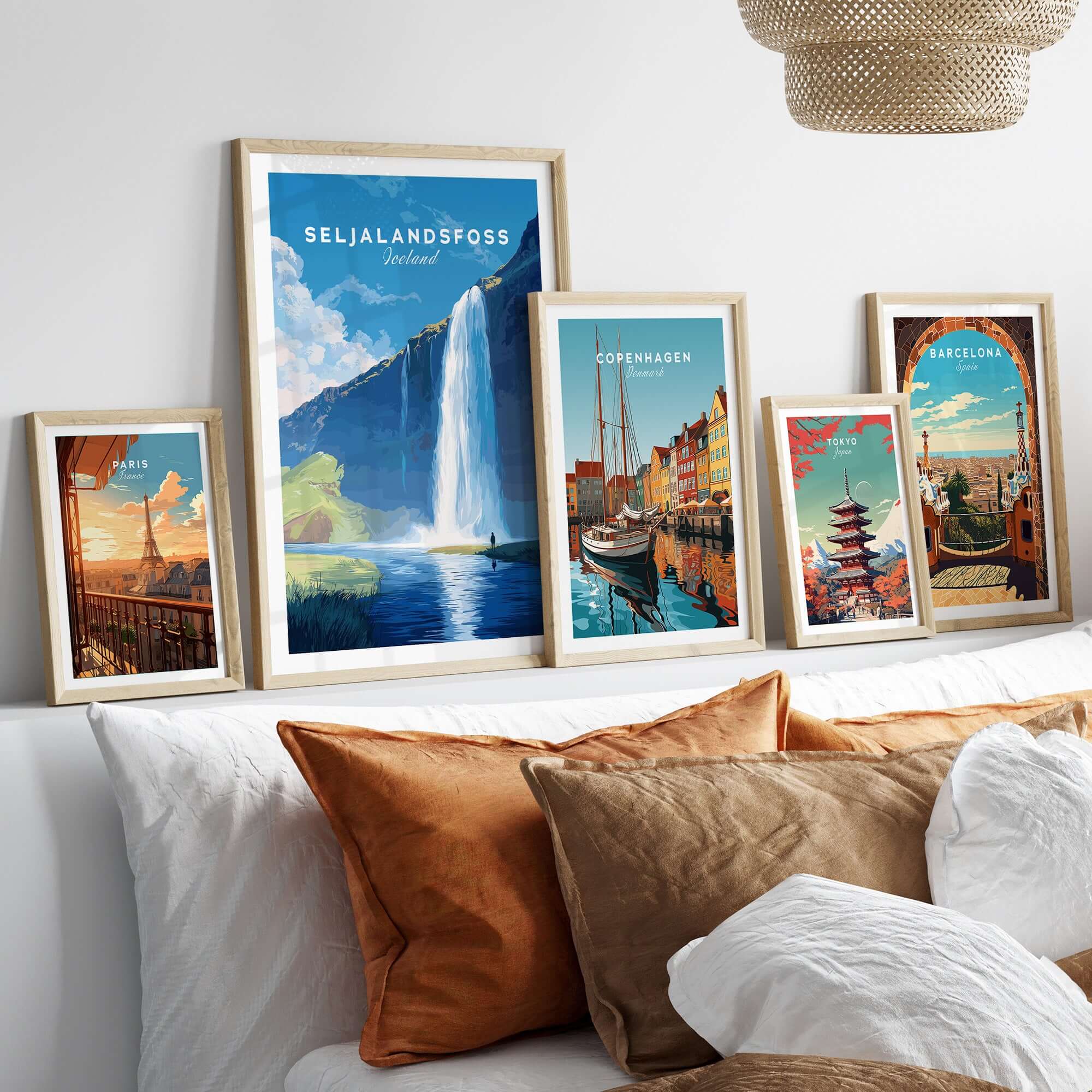 Seljalandsfoss Wall Art Iceland displayed among other travel-themed wall art in a cozy living room setting.
