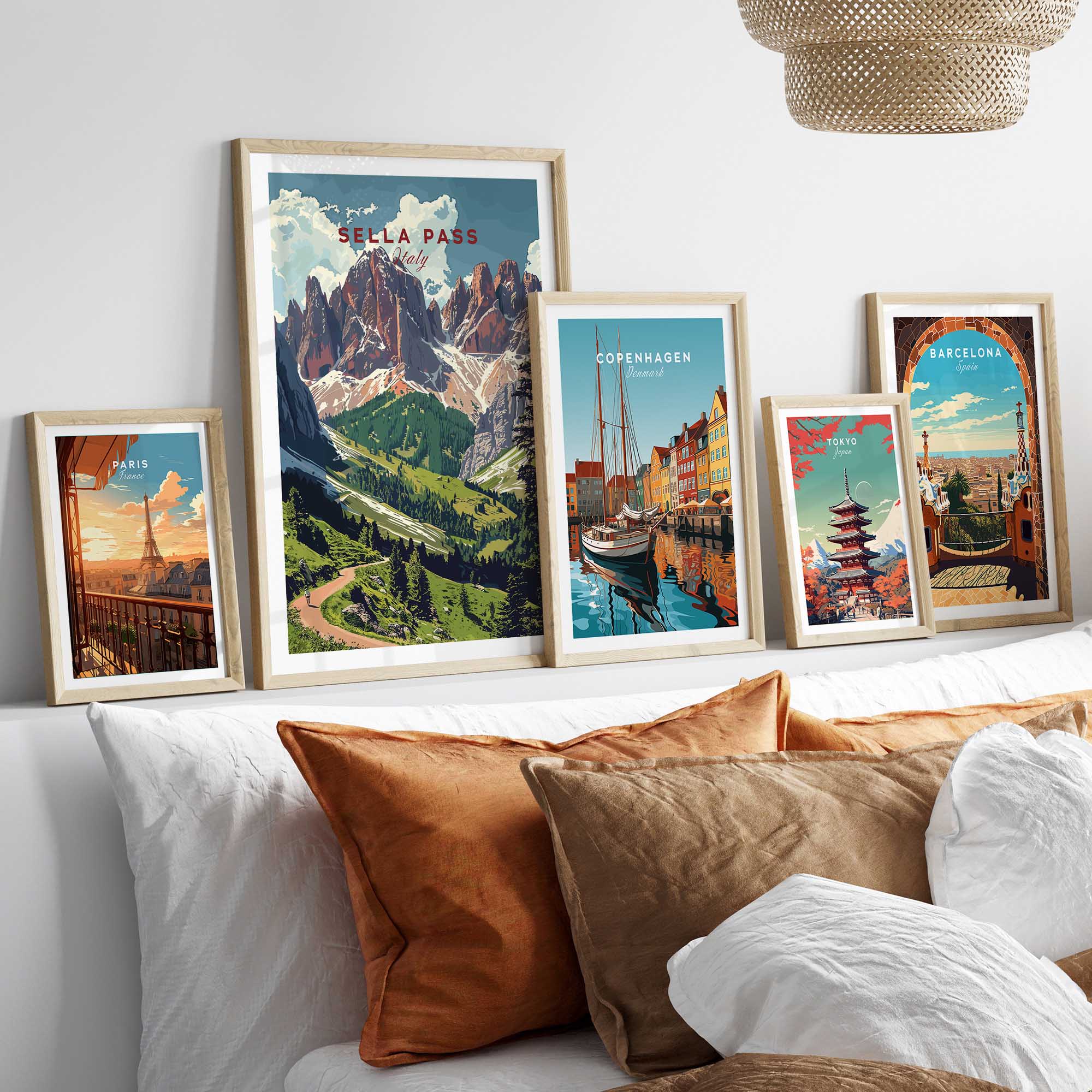 Sella Pass Poster Italy displayed among other travel posters on a stylish interior wall.