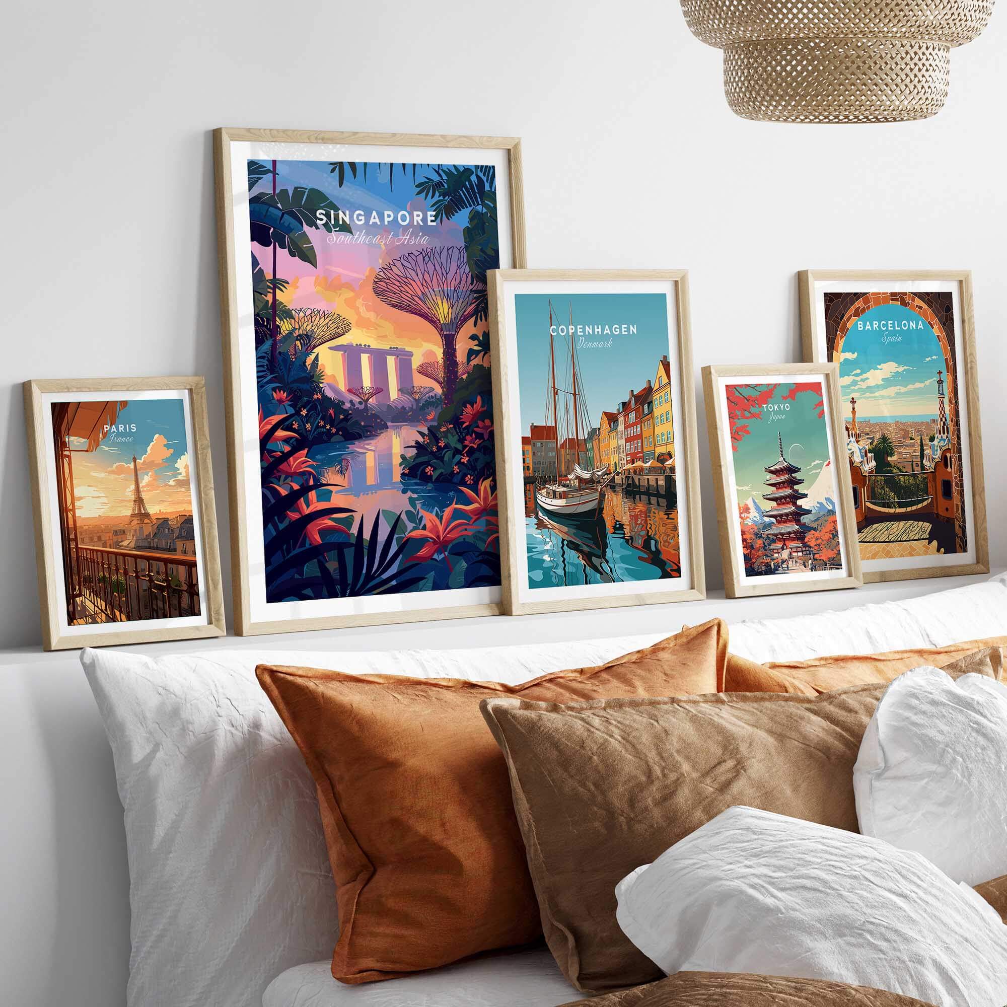 Singapore Poster displayed among various city travel posters on a stylish shelf with cozy cushions.