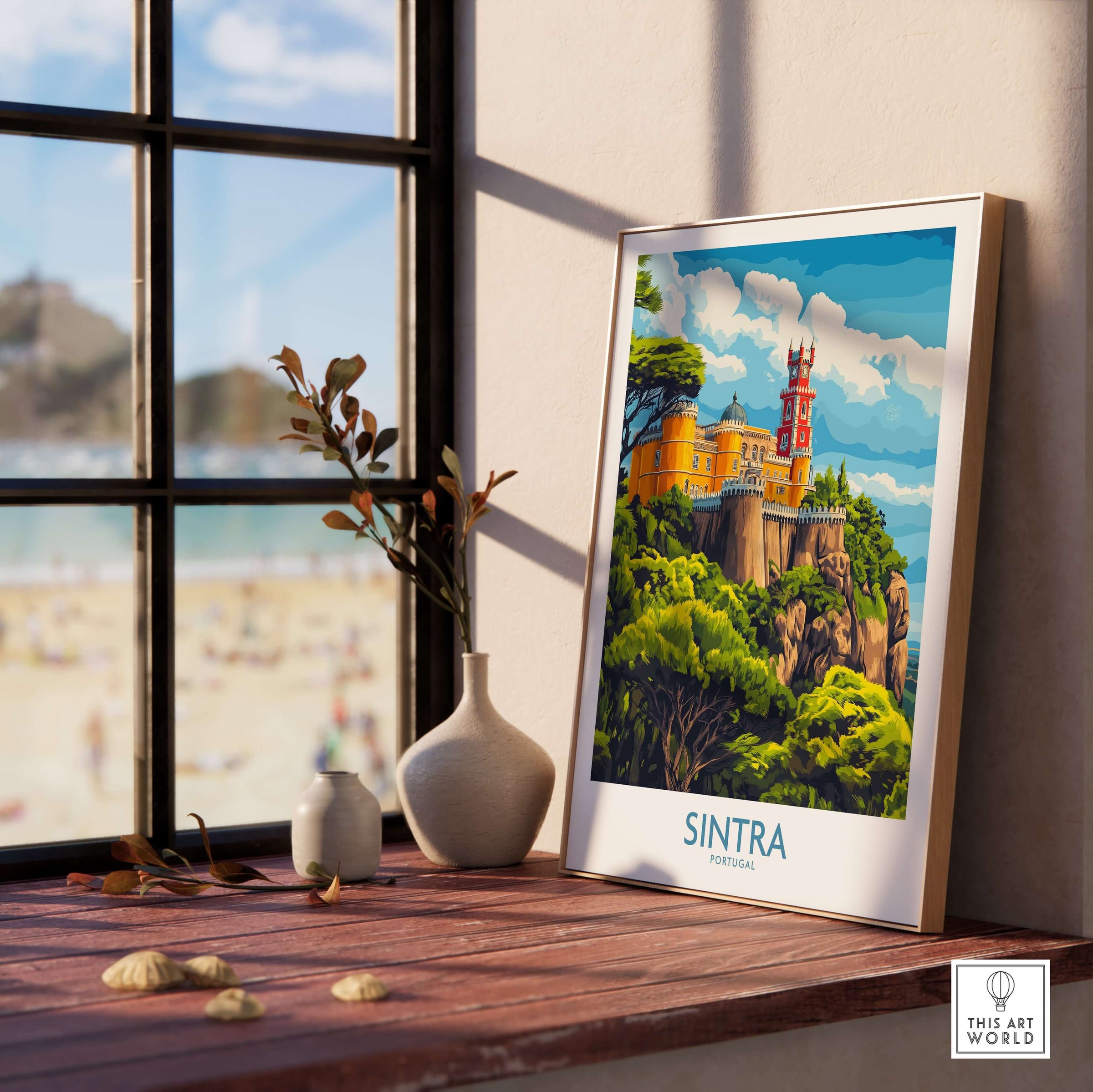 Sintra Portugal Pena Palace Art Print | Castle Poster displayed on a wooden table by a window with beach view.
