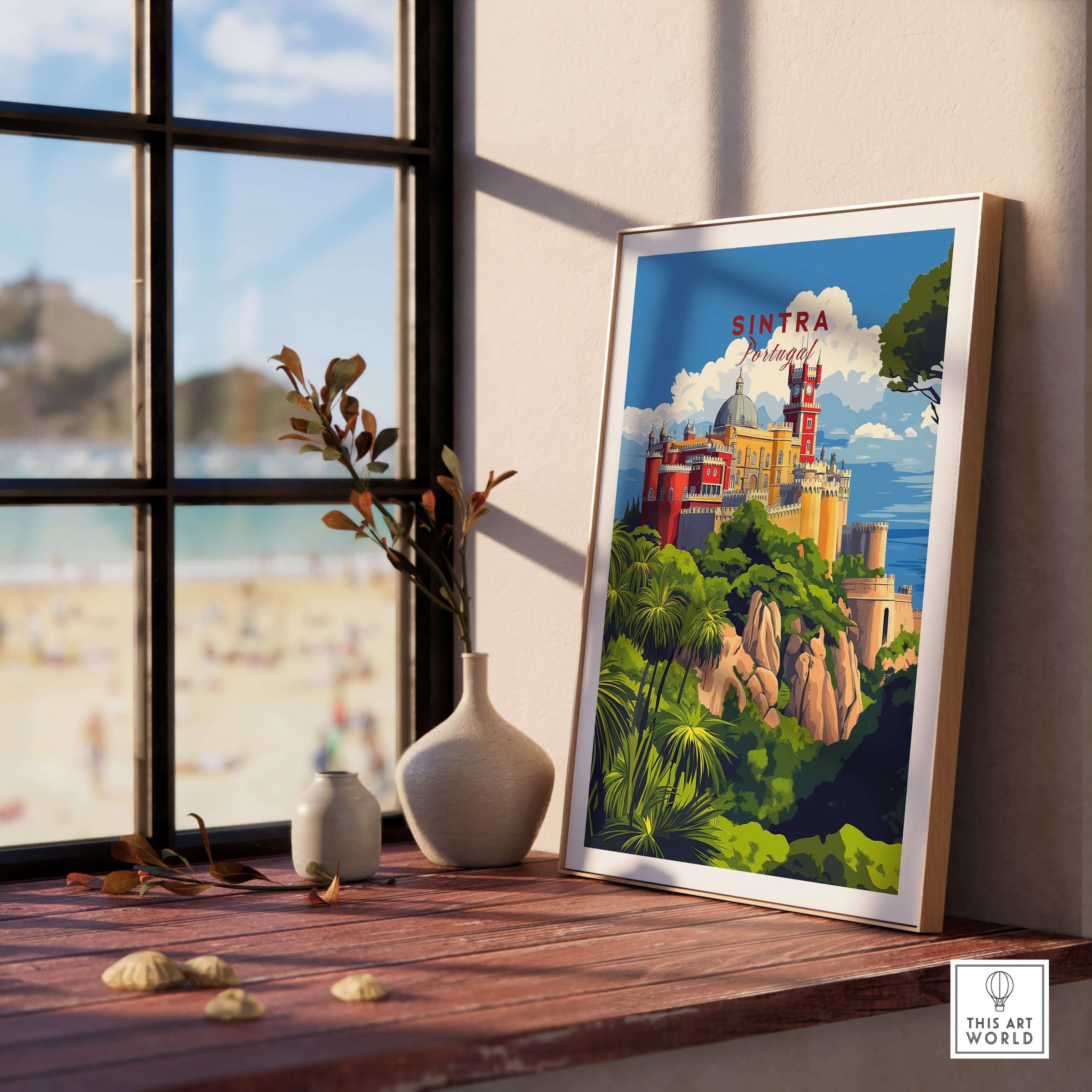 Sintra Poster | Portugal Print Pena Palace displayed on a wooden table near a window, showcasing vibrant colors and unique architecture.