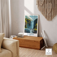Skógafoss Iceland Art Print Waterfall Poster displayed in a cozy living room setting with wooden decor.