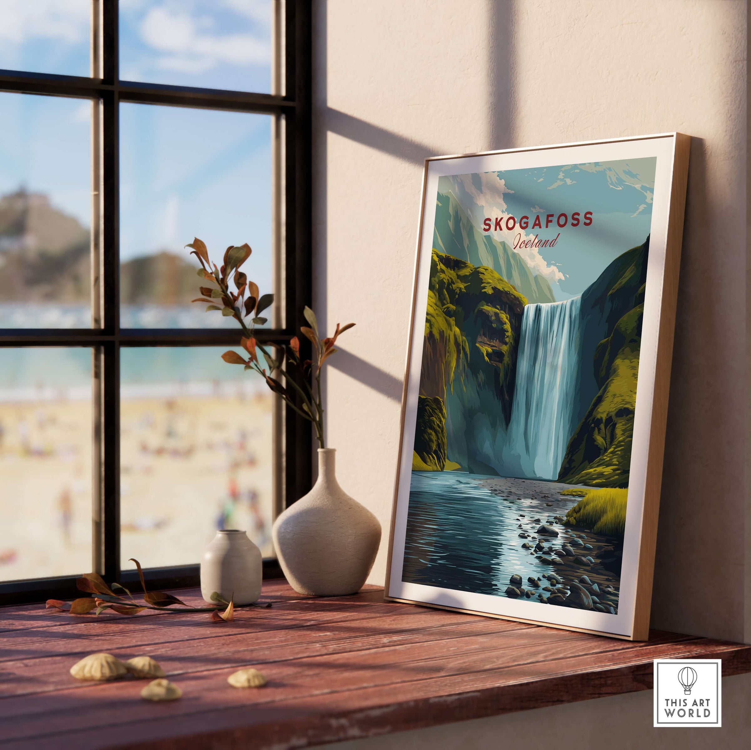 Skógafoss Icelandic Landscape and River Print | Nordic Nature Wall Decor framed on a table with a beach view.