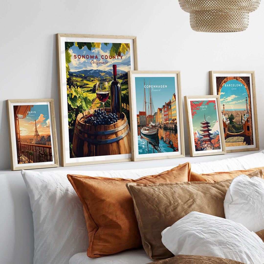 Sonoma Valley art print featuring wine and grapes among framed travel posters on a stylish living room wall decor.