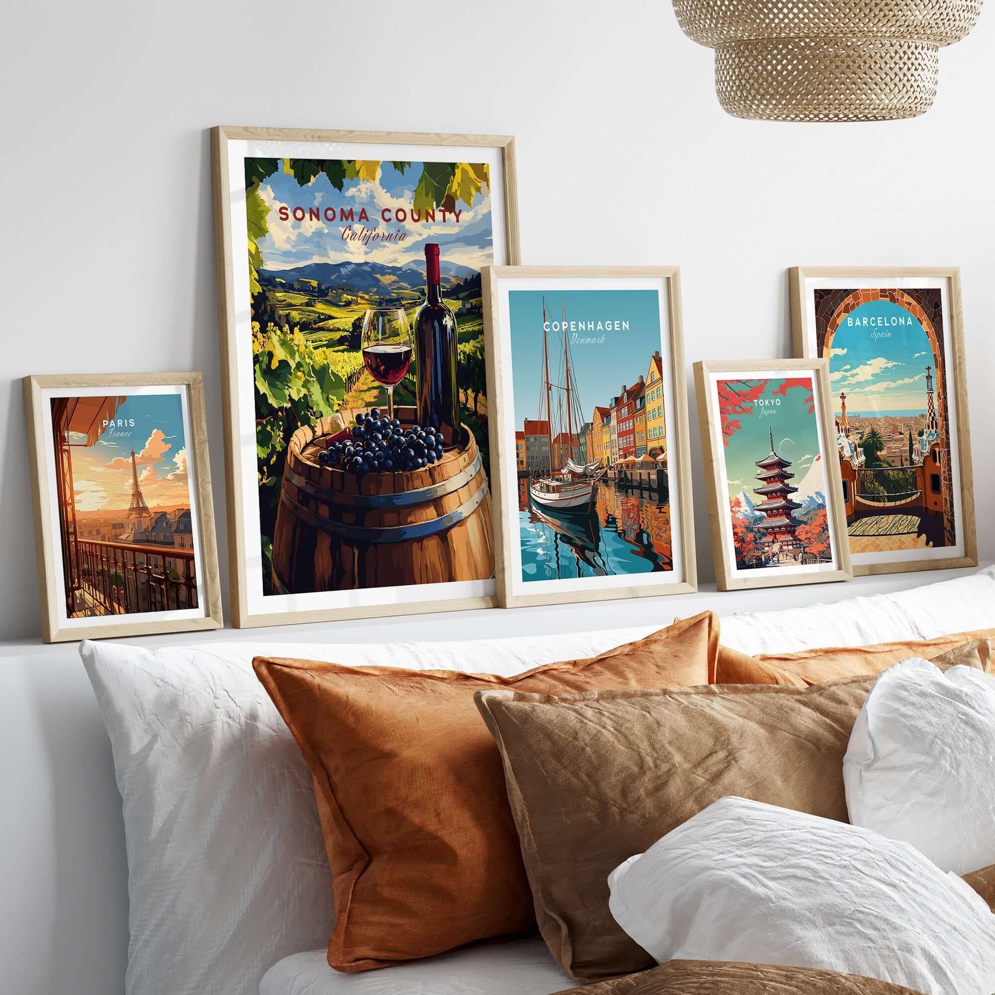 Sonoma Valley Art Print - Wine Bottle & Grapes Poster - Vineyard Landscape Decor displayed in stylish frames on a couch.