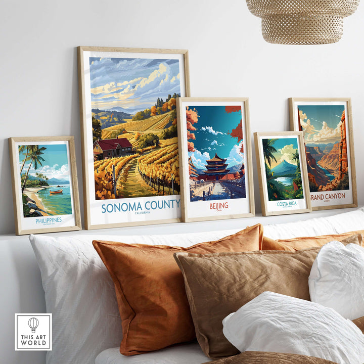 Sonoma Vineyard Farmhouse poster and travel prints displayed in stylish frames on a cozy sofa.