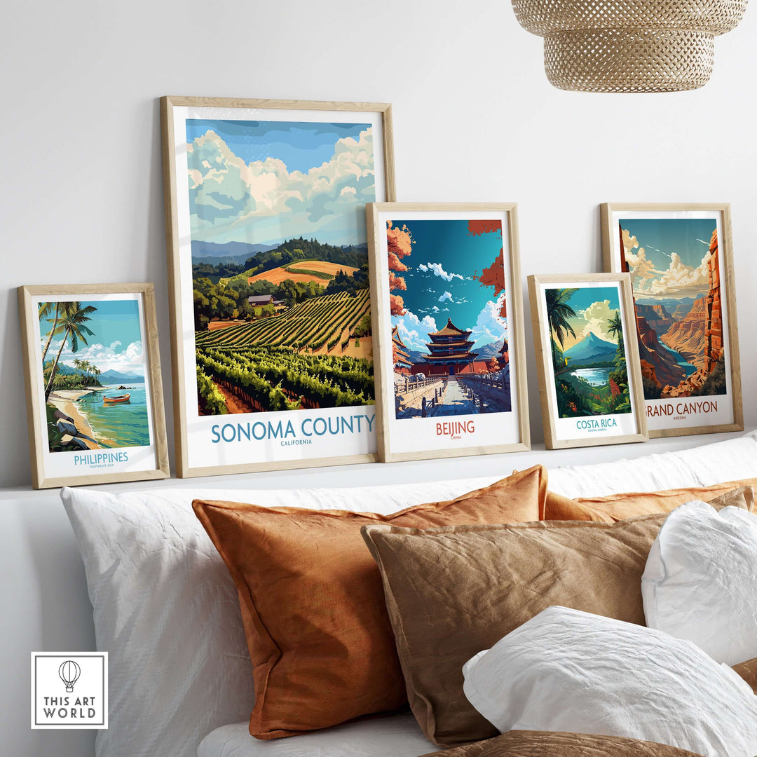 Collection of framed travel posters including Sonoma County, featuring vineyards, landscapes, and serene aesthetics in a home setting.