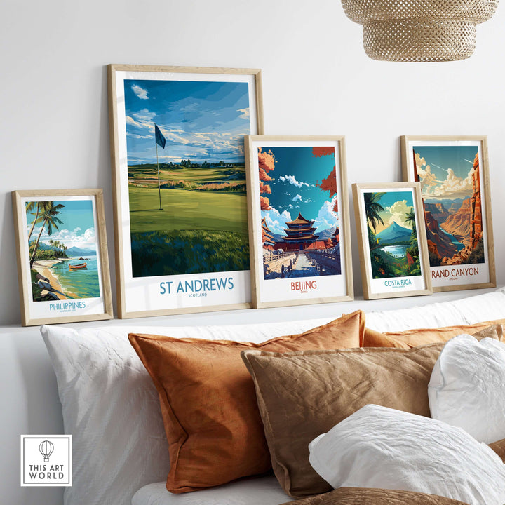 Decorative art prints featuring St Andrews golf course and various travel destinations on a stylish shelf.