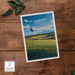 St Andrews Poster Scotland - Golf Print showcasing a golf course with a blue flag and scenic landscape.