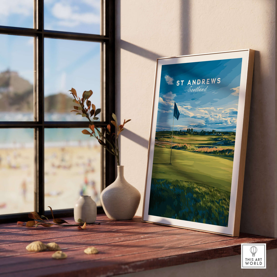 St Andrews Scotland golf poster displayed on a window sill, showcasing iconic golf landscape and vibrant colors.