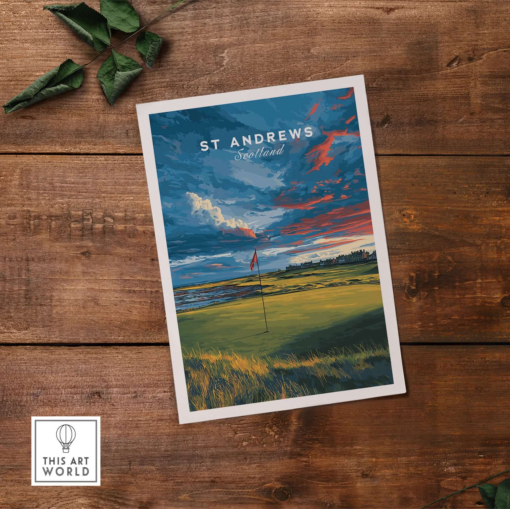 St Andrews Scotland Old Course Green Print - Famous Golf Course Poster displayed on a wooden surface showcasing its vibrant colors.