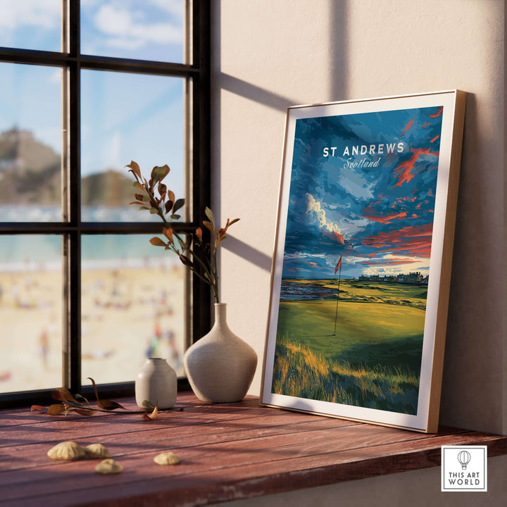 St Andrews Scotland Old Course green print poster displayed on a windowsill, showcasing golf's historic beauty.