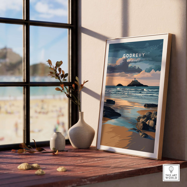 St Ives Bay art print featuring Godrevy Lighthouse, displayed on a seaside windowsill.