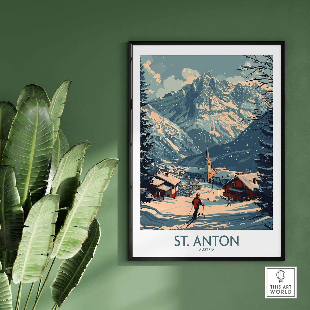 St. Anton ski poster featuring Austrian mountain scenery with snow-covered peaks and chalets, framed and displayed against a green wall.