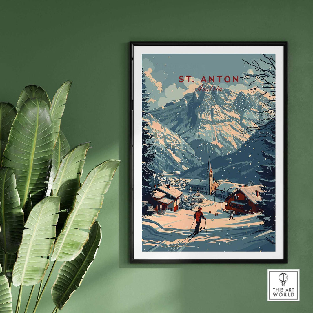 St. Anton ski poster showcasing snowy Austrian mountains and village in winter, framed and displayed against a green wall.