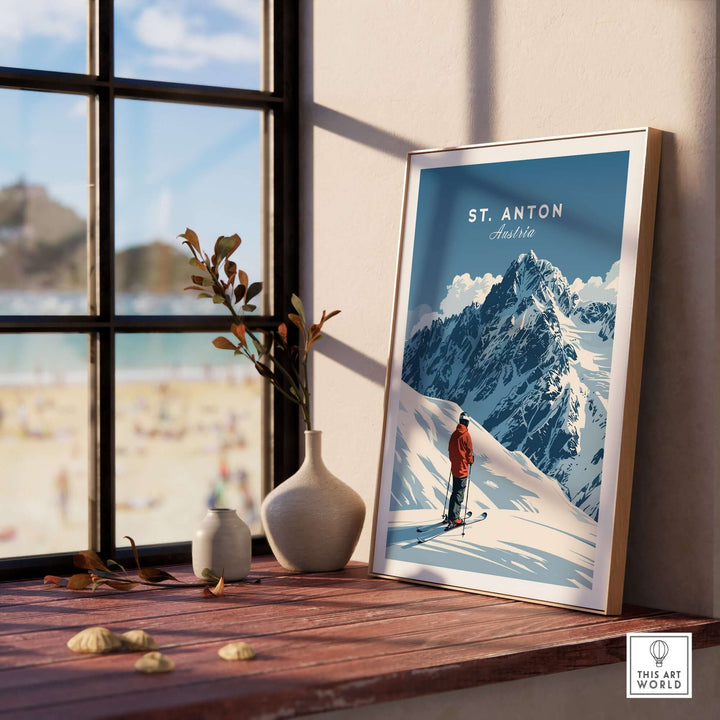 St. Anton Ski Print displayed on a table with a mountain scene, perfect for ski enthusiasts and home decor.