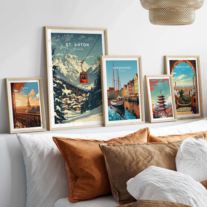 Gallery wall displaying a St. Anton ski poster and various travel art prints in a cozy living room setting.