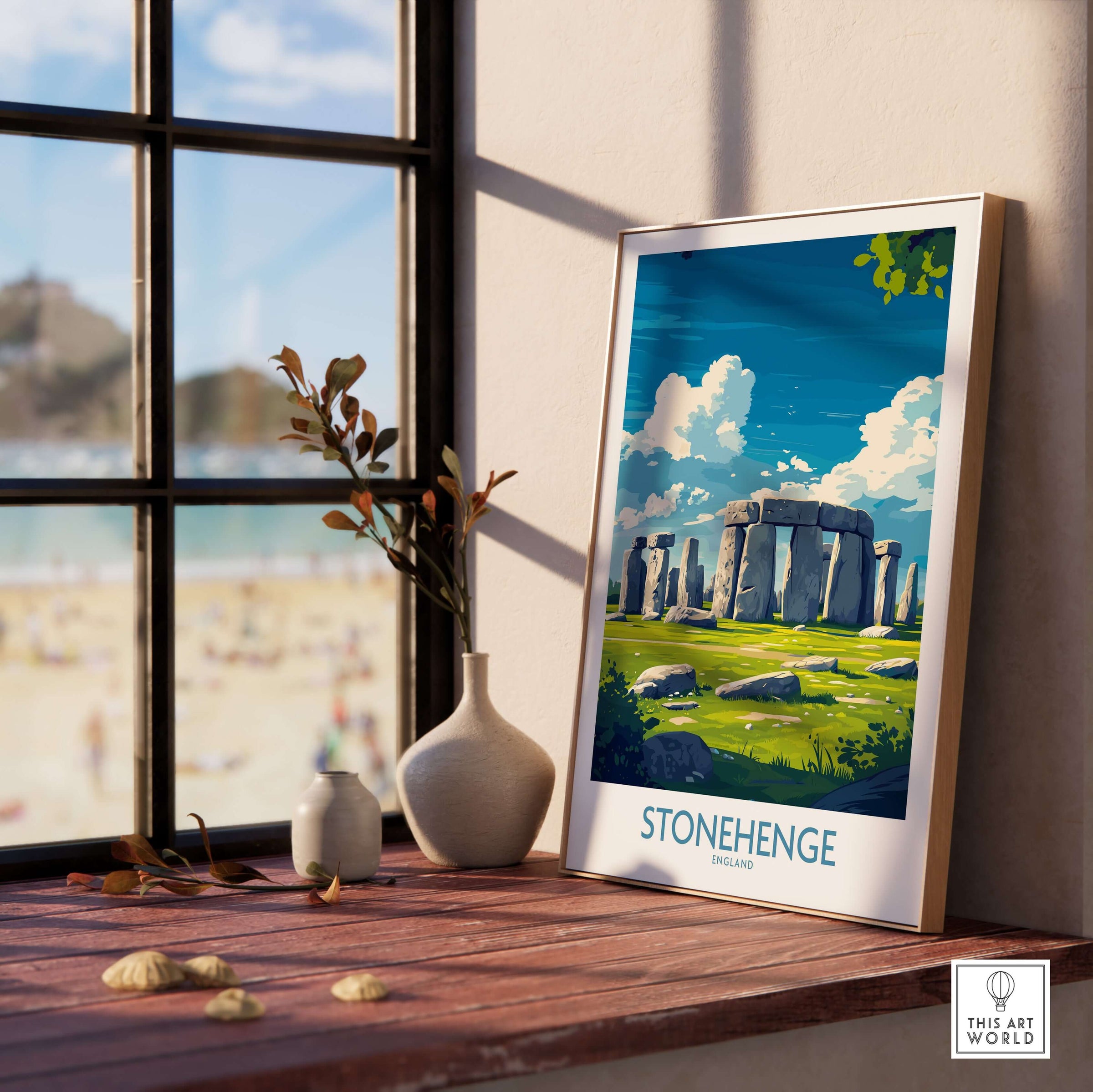 Stonehenge Art Print - England Poster - Wall Decor displayed on a wooden table by a window with greenery.