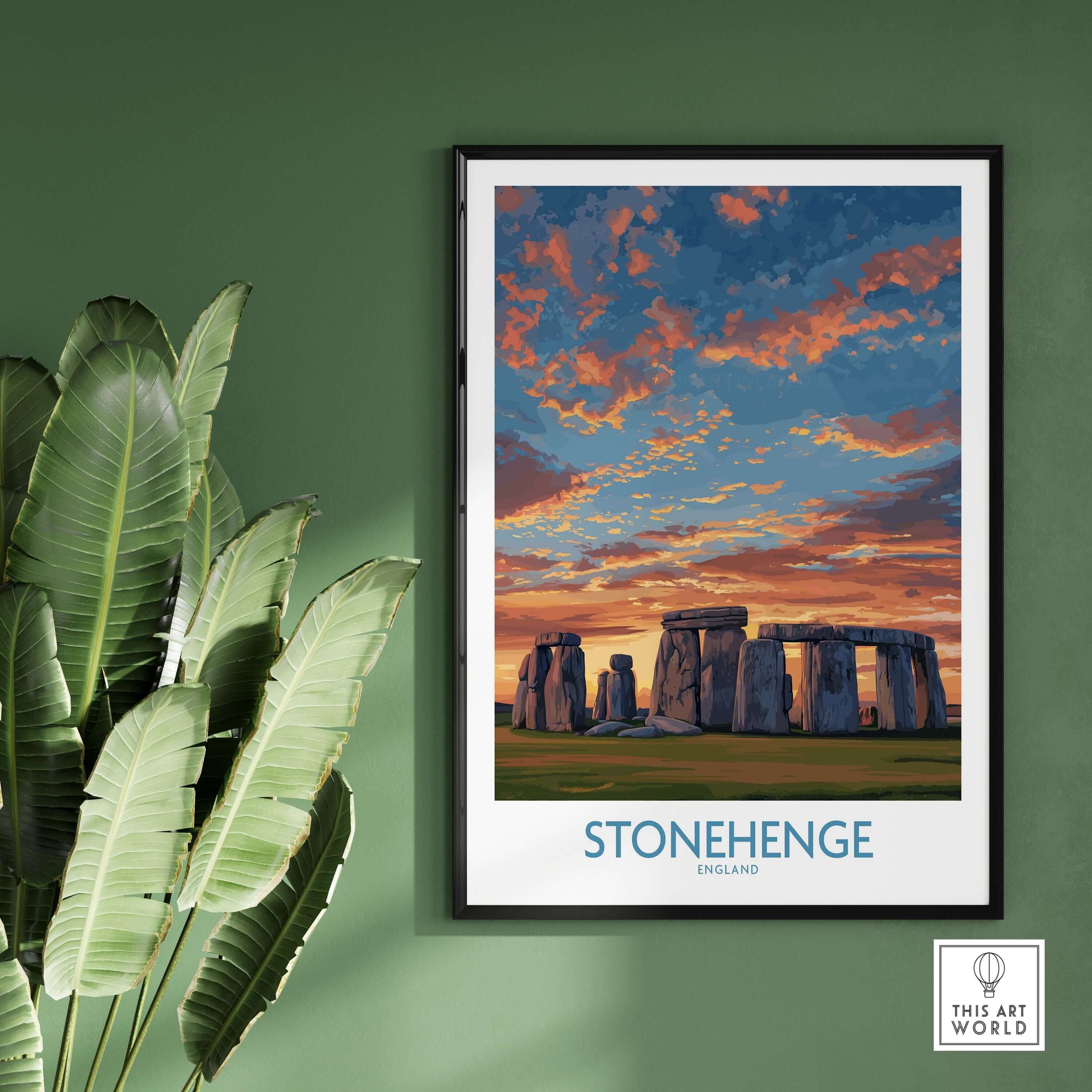 Stonehenge Poster - England Prehistoric Site Art Print - Orange Sky Wall Decor displayed with tropical leaves.
