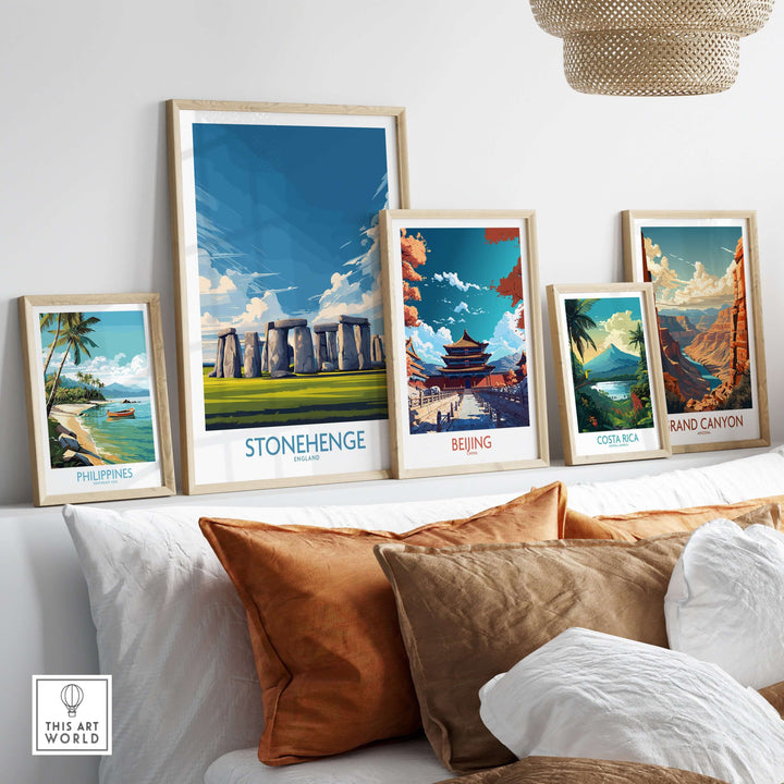 Colorful travel prints on a wall featuring Stonehenge and other iconic landmarks, enhancing home decor.