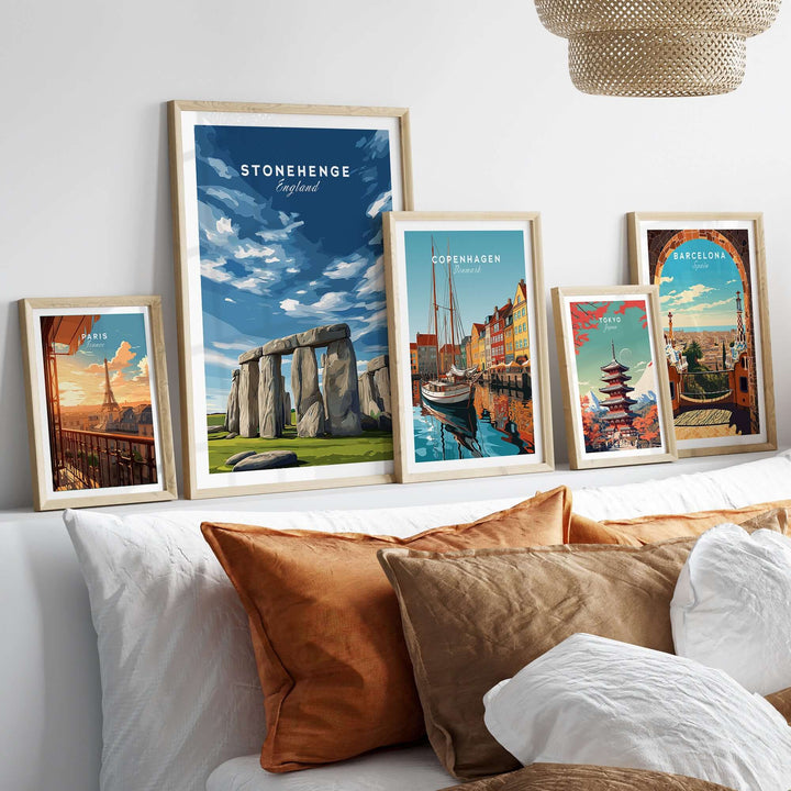 Stonehenge print framed among other travel posters on a cozy couch, perfect wall art for history and travel enthusiasts.
