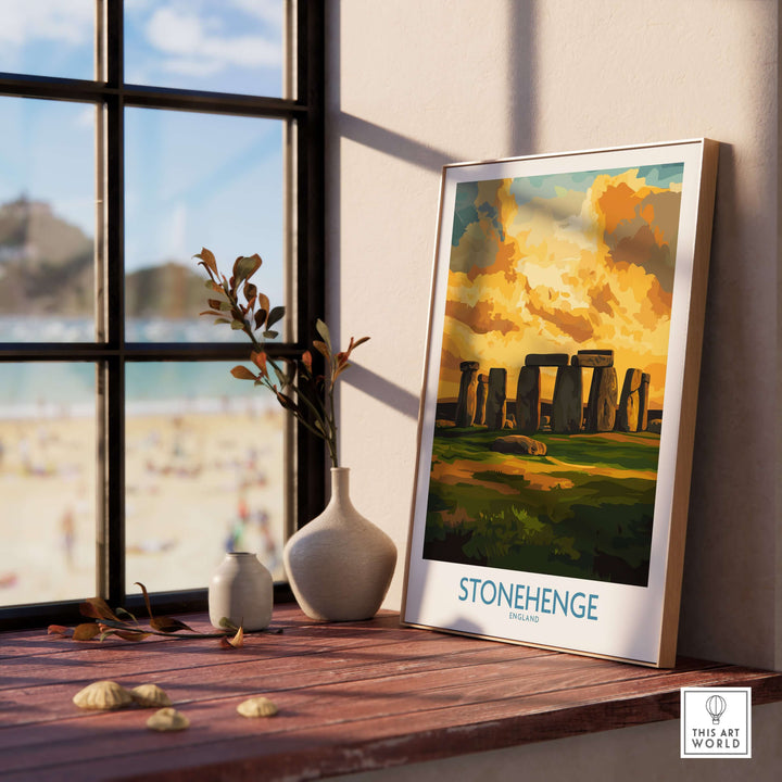 Stonehenge sunset poster displayed on a wooden table by a window, showcasing vibrant colors and ancient monument design.