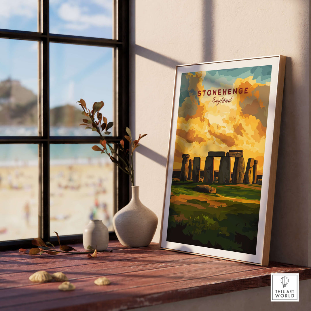 Stonehenge travel print displayed on a windowsill, showcasing the Wiltshire landscape and iconic stone circle.