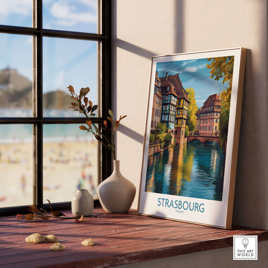 Strasbourg France Art Print showcased in a cozy interior by a window with scenic view and decorative elements.