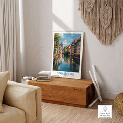 Strasbourg France Art Print | Petite France Travel Poster displayed in a cozy living room featuring scenic canals.