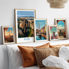 Ronda Spain Poster | Stunning Gorge Landscape Scene Canvas Print showcased with other city posters on a stylish wall.