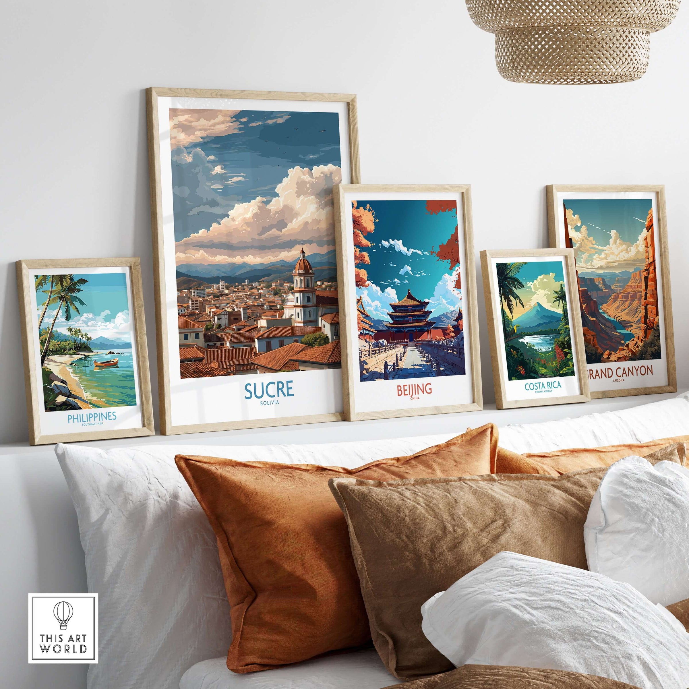 Sucre Bolivia Art Print | Mountain Skyline Poster displayed among travel-themed art prints on a cozy sofa.