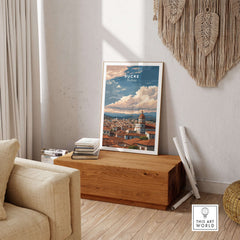 Sucre Print | Bolivian Travel Wall Decor displayed in a cozy living room setting with wooden furniture and decor.