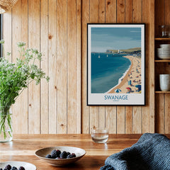 Swanage Dorset Poster | White Cliffs & Coastal Sailboat Scene Canvas Print displayed in a cozy interior with wooden decor.