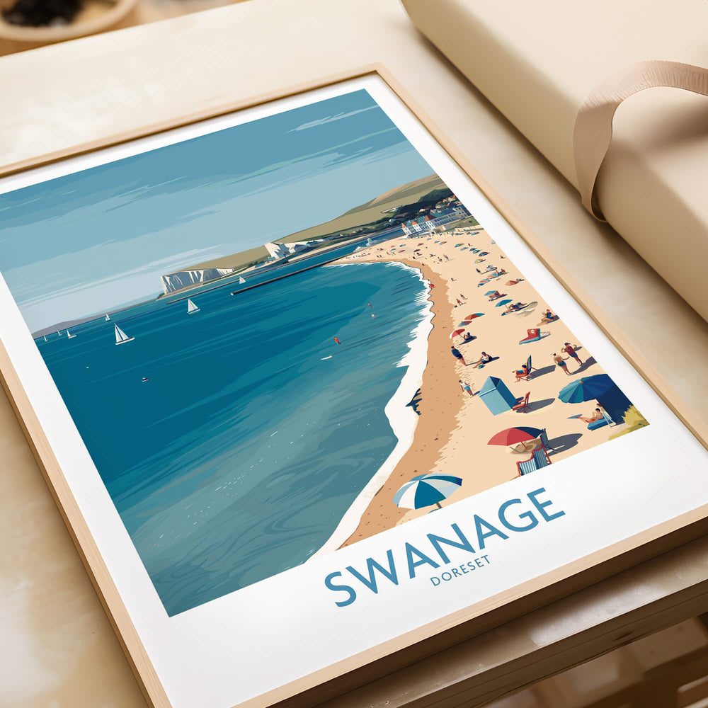 Swanage Dorset Poster | White Cliffs & Coastal Sailboat Scene Canvas Print displayed on a table.