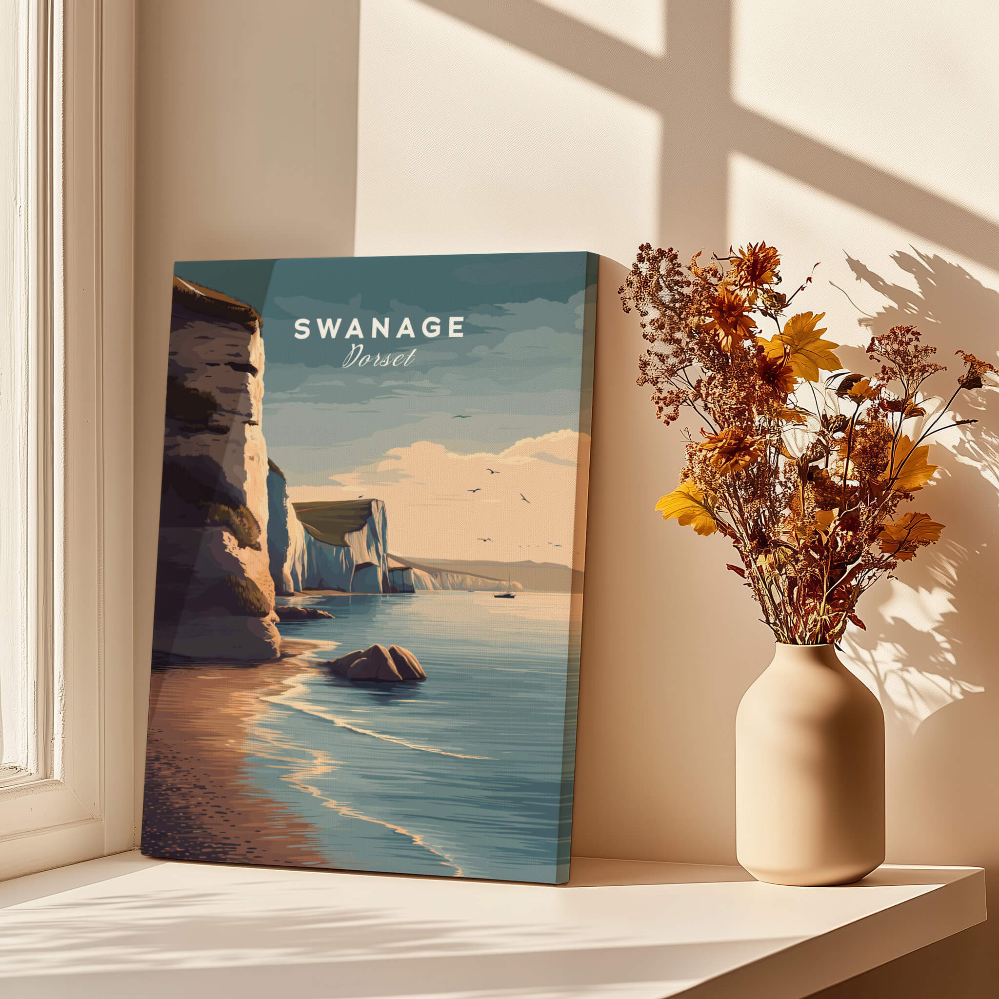 Swanage Print Dorset Wall Art | Old Harry Rocks Coastline Travel Poster displayed in a sunlit room with flowers.
