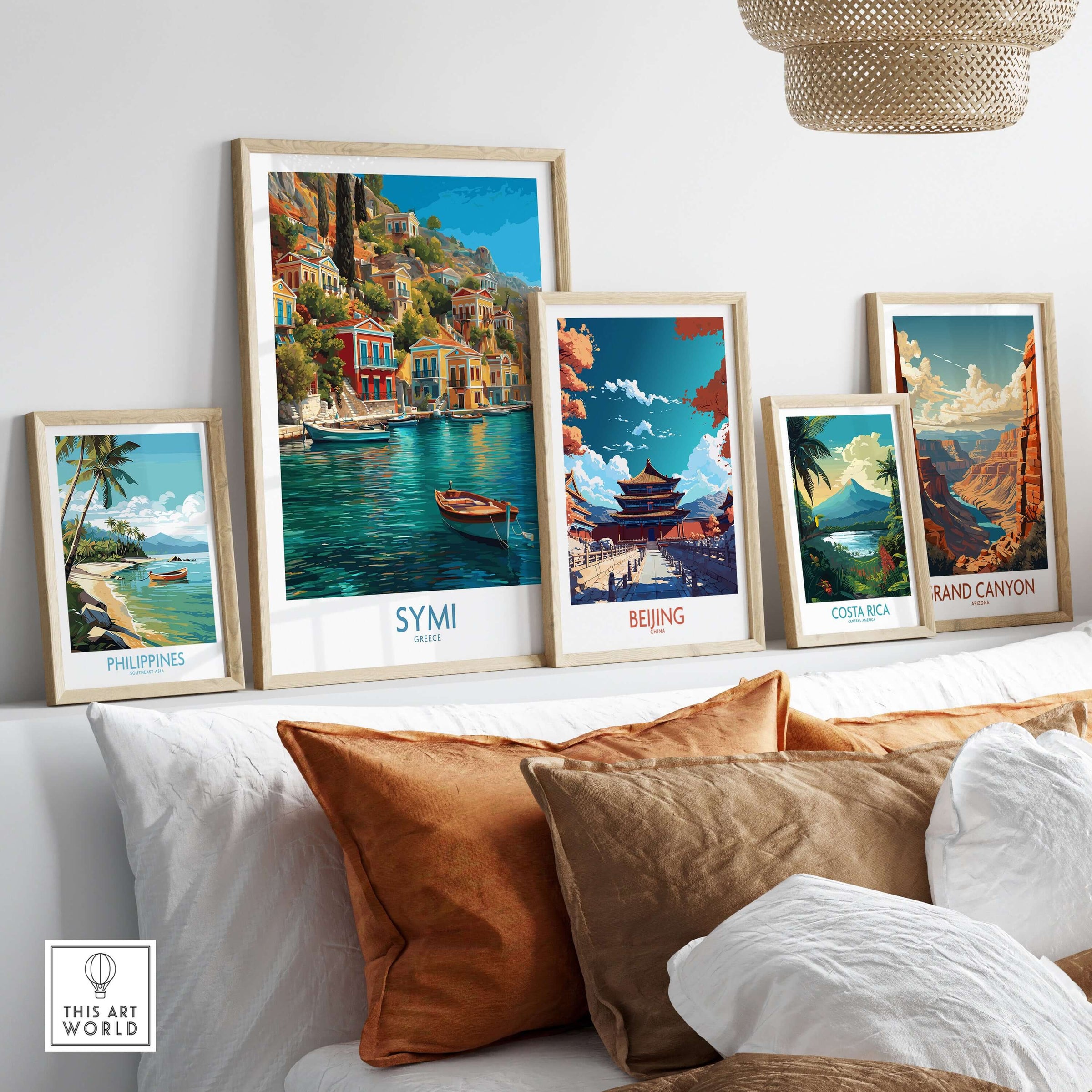 Symi Greece Art Print | Harbour Boats Seascape Poster displayed among other travel art prints on a cozy sofa.