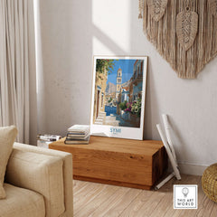 Symi Greece Art Print Greek Poster featuring vibrant architecture in a cozy interior setting.