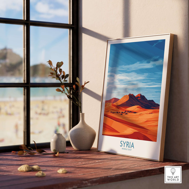 Syria desert landscape poster on a windowsill, showcasing abstract sand dunes and Middle East travel art.