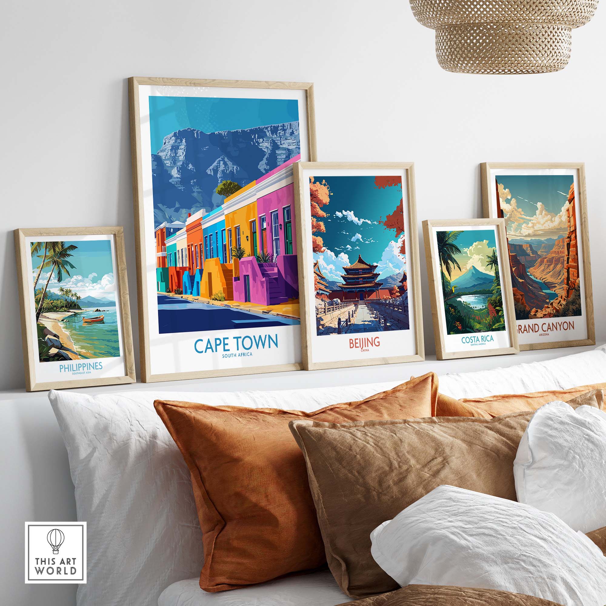 Colorful travel posters of Cape Town, Beijing, Costa Rica, and the Grand Canyon displayed in a stylish home setting.