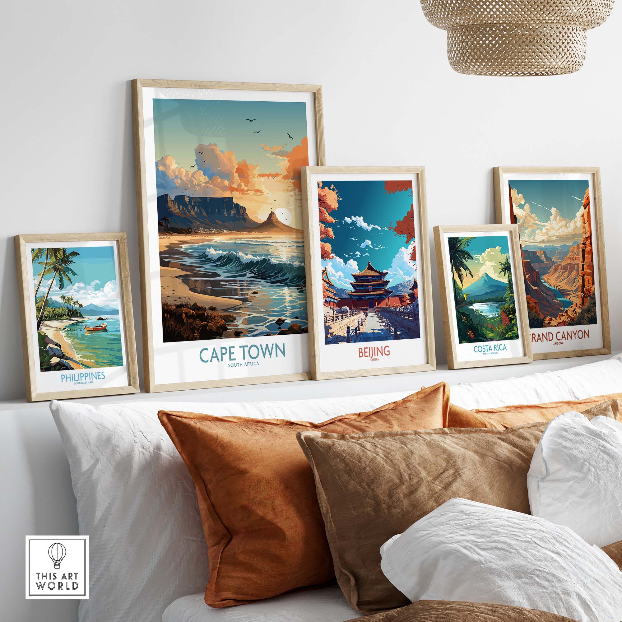 Table Mountain print alongside travel art prints from Cape Town, Beijing, Costa Rica, and the Grand Canyon displayed on a couch.