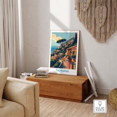 Taormina Travel Print - Vibrant Souvenir of Italys Beautiful Coastline displayed in a modern living room setting.