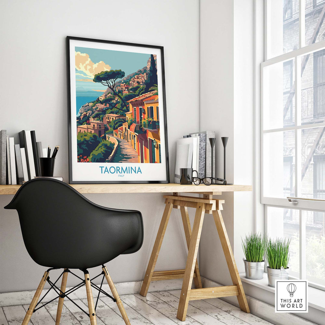 Taormina Travel Print displayed in modern home office with scenic Italian coastline in the artwork.