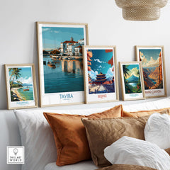 Tavira Algarve Poster, Portugal Travel Print, Wall Art displayed among other travel prints in a cozy living room setting.