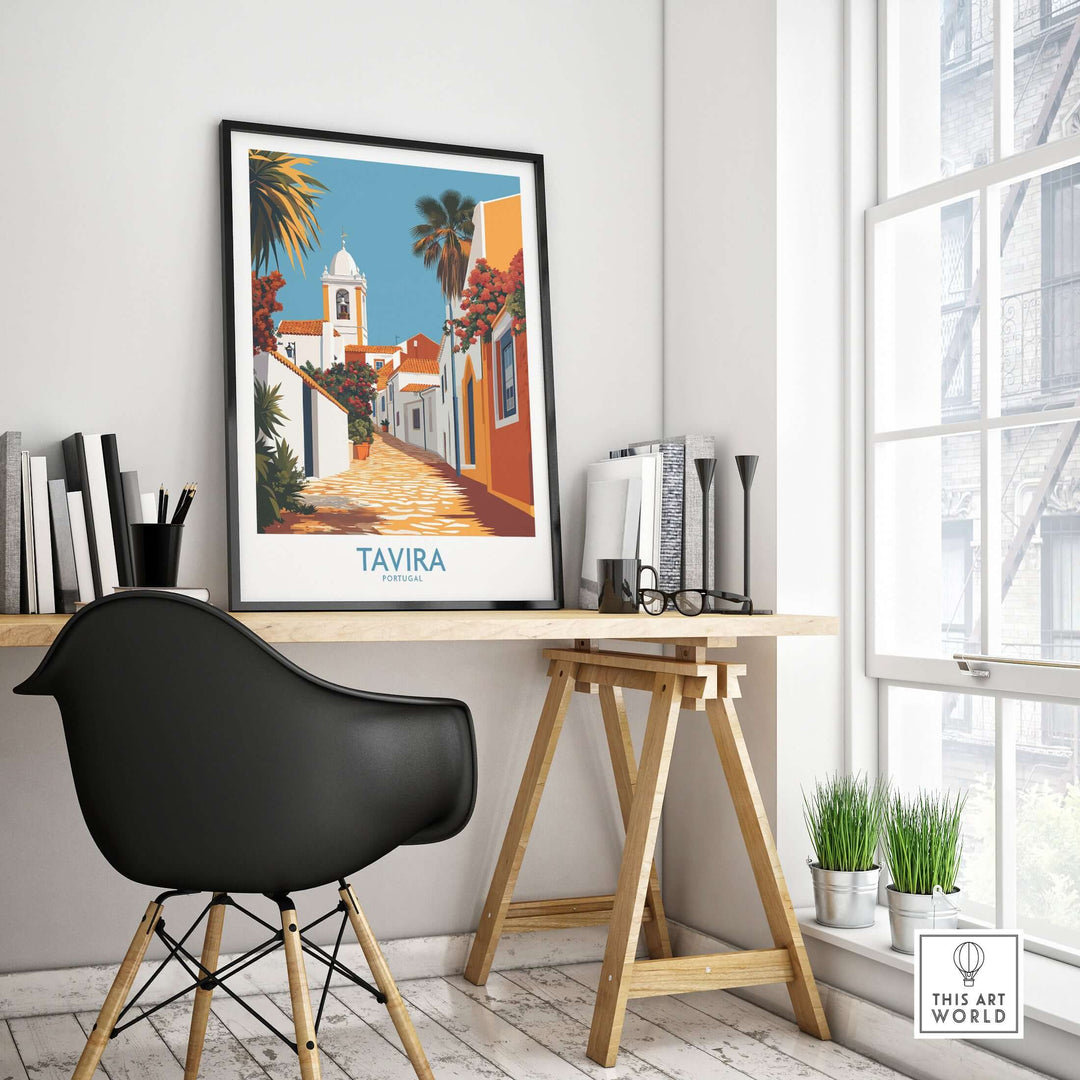 Tavira Old Town poster displayed in a stylish workspace, showcasing traditional Portuguese architecture and vibrant streets.